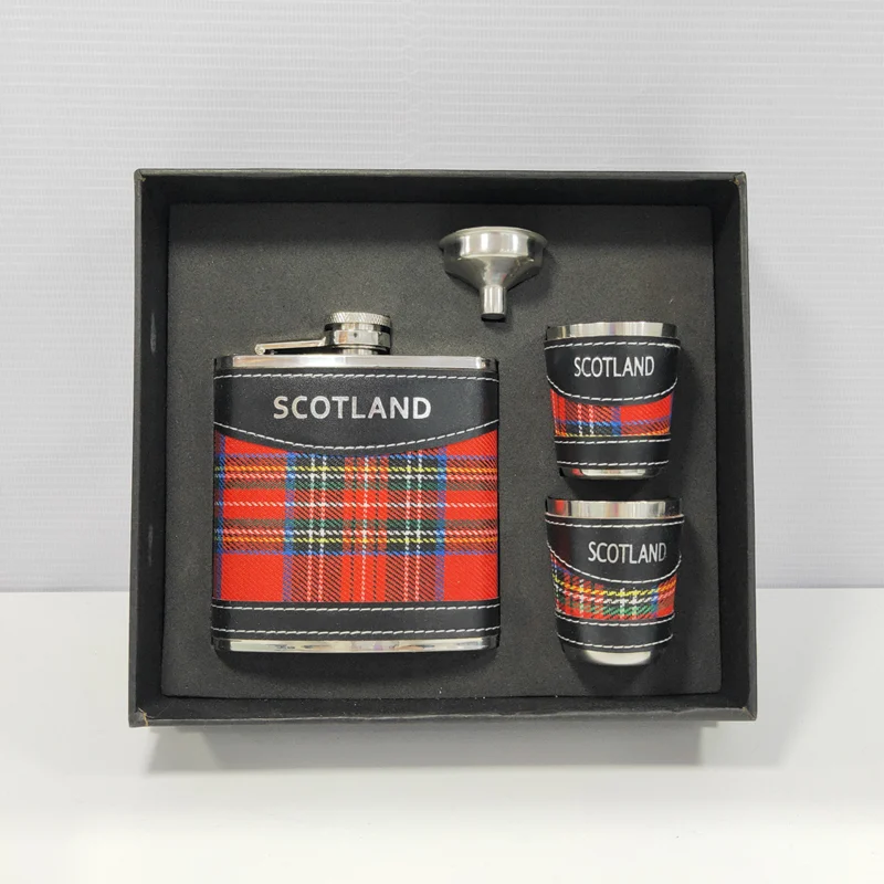 Six-ounce stainless steel hip flask wrapped in red tartan leather with black straps at the shoulder and base, silver foil logo on the upper strap, two matching 50ml cups and a funnel, GL-FGB series
