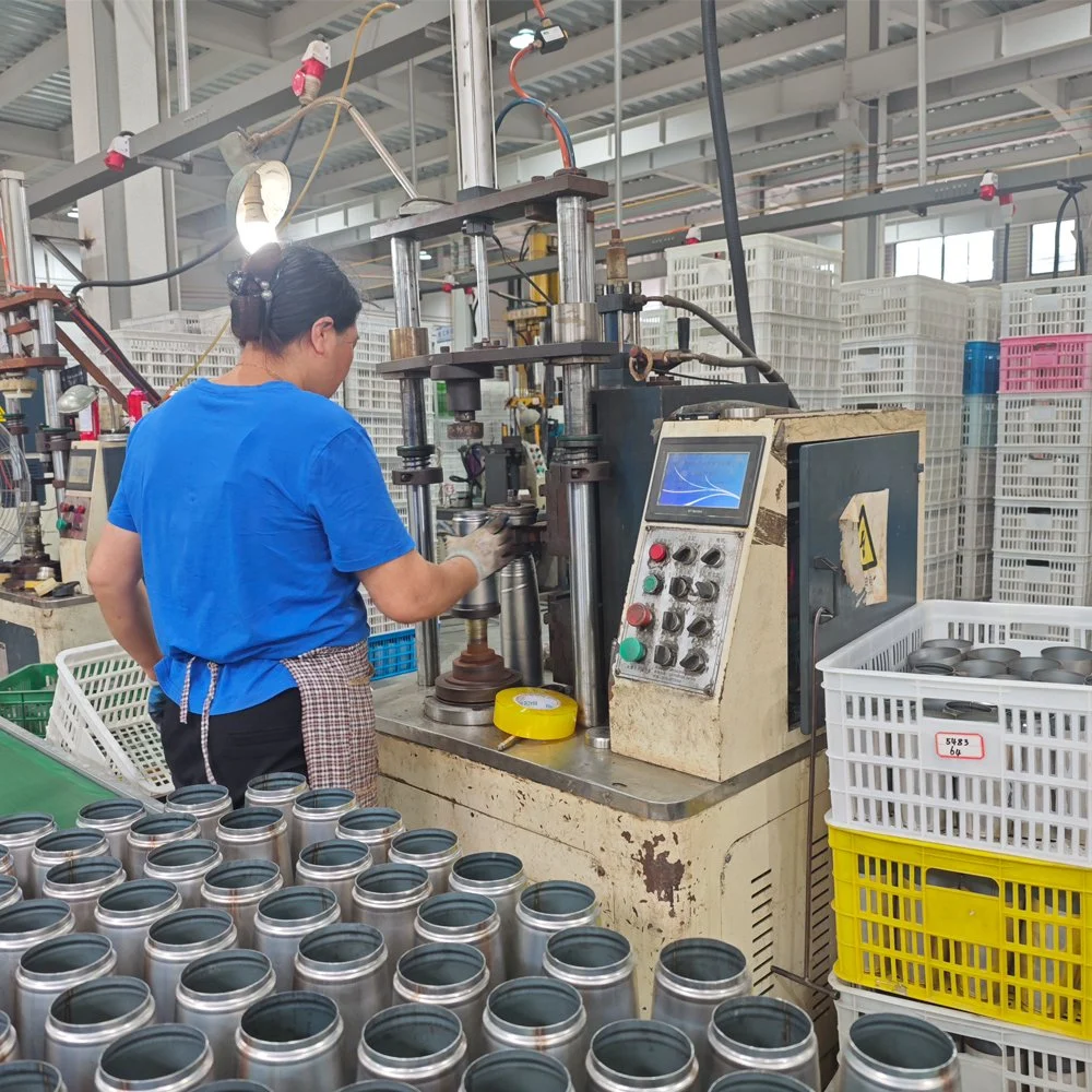 Worker operating a machine on the production line